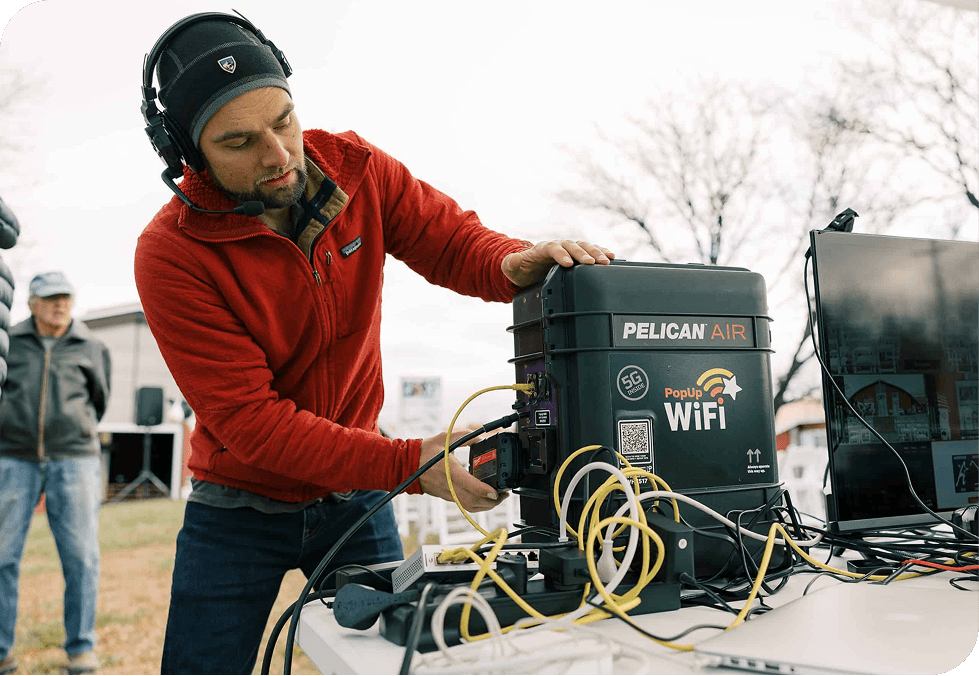 Producer adding a battery to the PopUp WiFi Workhorse